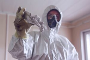 professional removing asbestos from home