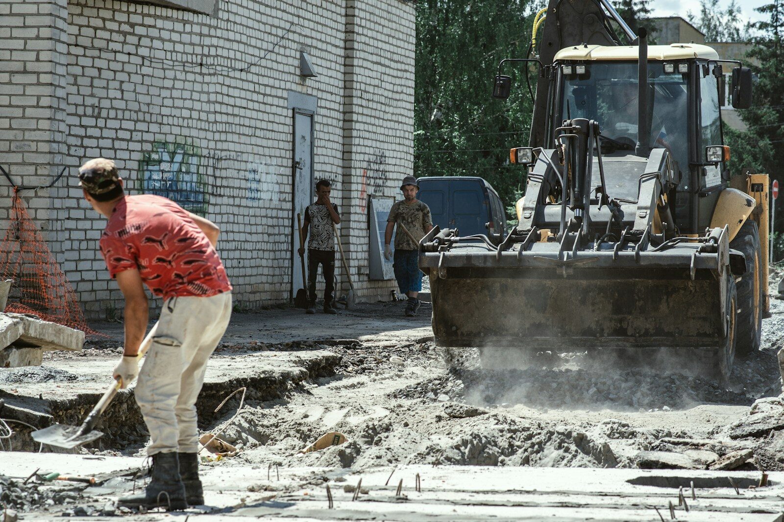 Concrete driveway sections being removed before replacement.